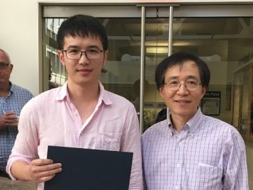 Professor Xuming He awarding Yi Yang an Outstanding first year Master's student award for the 2015-2016 academic year 